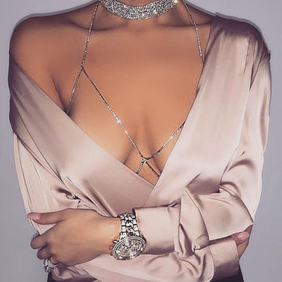 Front view of rhinestone body chain necklace on model