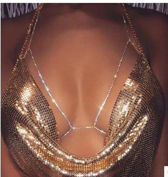Rhinestone body necklace worn with crop top