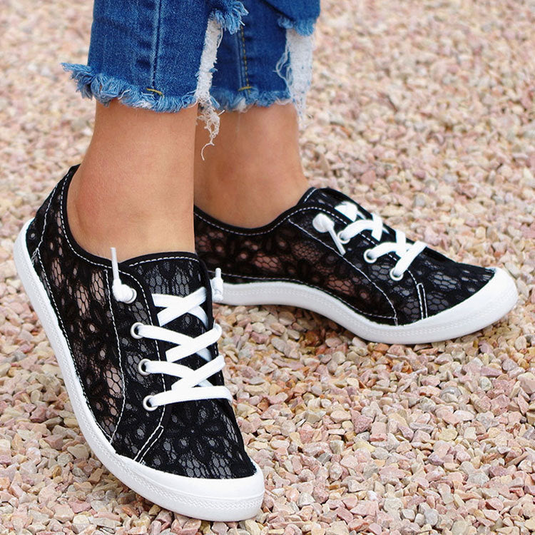 Side view of women’s lace flat summer shoes