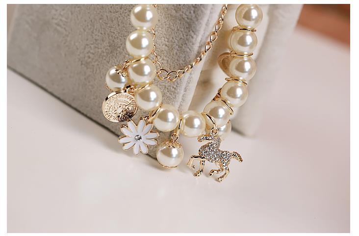 Dainty flower bracelet worn by female model