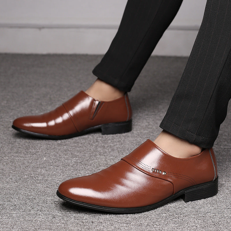 Man wearing pointed leather shoes at office