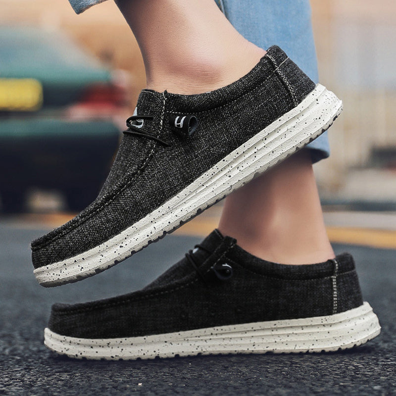 Slip-on casual shoes for men on wooden background

