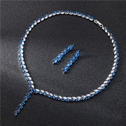 Crystal bridal jewelry on white fabric


