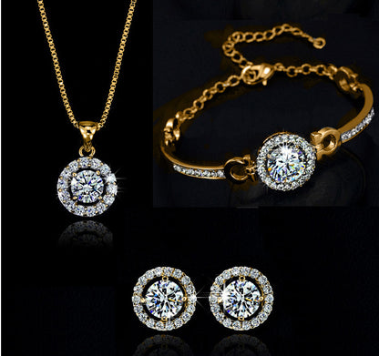 Silver bracelet and necklace combo on display stand

