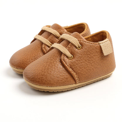 Detail of Velcro strap on toddler walking shoes


